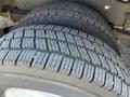 A close-up view of a tire from a 2012 Ford Econoline showcasing the tread pattern and rubber texture