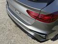 A 2024 Kia Forte5 with a sleek rear design featuring prominent taillights and a sporty badge