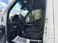 Interior of a 2020 Mercedes-Benz Sprinter 2500 showing the driver's seat steering wheel and dashboard with a thank you note on the floor
