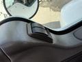 Close-up of a door handle on the interior of a 2008 Kenworth T370 truck