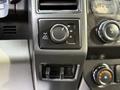 Dashboard controls of a 2017 Ford F-450 Super Duty featuring a four-wheel drive selector and additional knobs for audio and auxiliary functions