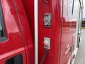 A red 2007 Ford F-550 fire rescue vehicle with a shoreline connection located on the side