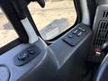 Interior view of a 2008 International 7500 featuring control buttons for windows and mirrors located on the driver's side panel