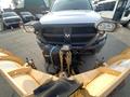 A 2016 RAM 5500 truck equipped with a front-mounted snow plow and two large headlights attached to the plow setup