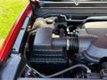 Close-up view of the engine compartment of a 2018 GMC Canyon showing components like the air intake and hoses