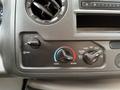 Control panel of a 2024 Ford E-450 featuring temperature and airflow adjustment knobs with labeled settings for fan speed and air conditioning