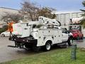 A 2008 Ford F-550 with an Altec bucket truck attachment and a utility body designed for maintenance and service tasks