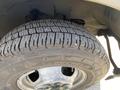 Close-up of a Michelin tire mounted on a 2020 Chevrolet Express showcasing its tread pattern and wheel rim