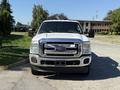 A 2012 Ford F-350 SD truck with a white exterior visible from the front showcasing its grille headlights and prominent Ford logo