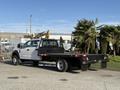 A 2020 Ford F-550 heavy-duty truck with a flatbed design parked on a paved surface