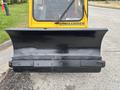 Front view of a 2004 Bombardier SW48 snowplow blade with a black metal plow attachment designed for clearing snow and ice