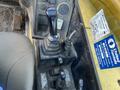 Control panel of a 2013 JCB 510-56 Loadall featuring various levers and switches for operating the equipment