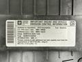 2013 Chevrolet Express emission control information label detailing fuel type and environmental compliance requirements