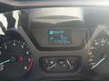 Dashboard of a 2016 Ford Transit showing digital speedometer and odometer reading 114372 km with a gear selector indicator and warning lights