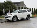 A white 2018 Toyota 4Runner parked with a modern design featuring chrome accents and alloy wheels
