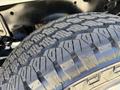 Close-up of a tire tread from a 2020 Ford F-350 SD showing deep grooves and robust patterns designed for traction and durability