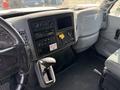Interior view of a 2006 International 4300 showing the dashboard with various controls gauges and a gear shifter