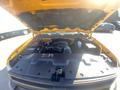 Open hood of a 2013 Chevrolet Silverado 1500 revealing the engine compartment with various components visible