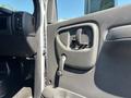 Interior door handle of a 2007 GMC C4500 TopKick with a manual door release lever visible