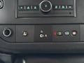 Interior dashboard controls of a 2021 Chevrolet Express showing buttons for various functions including power and settings