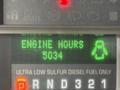 Display screen of a 2010 Ford F-550 showing engine hours at 5034 with a fuel type indicator for ultra low sulfur diesel fuel only