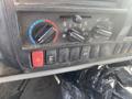 Dashboard controls of a 2019 Hino 195 including climate settings air conditioning and hazard light switch