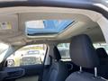 Interior view of a 2023 Ford Bronco Sport featuring black fabric seats and a panoramic sunroof above