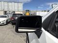 A side mirror of a white 2019 Chevrolet Silverado 1500 with a reflective surface displaying a blank screen