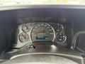 Dashboard of a 2013 Chevrolet Express displaying speedometer fuel gauge and temperature reading