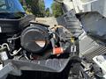 Close-up view of the engine compartment of a 2011 International 4300 showing the engine and various components with the hood raised