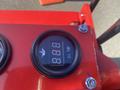 Close-up of a digital oil temperature gauge displaying 89 degrees on a red control panel of a 2025 AGT Industrial SDA-140TZ