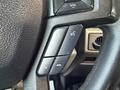Steering wheel controls of a 2018 Ford F-350 including buttons for volume phone connectivity and other functions