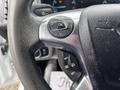 Close-up of a steering wheel with buttons for navigation and control on a 2019 Ford Transit Connect