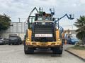 A yellow 2012 Caterpillar 980 wheel loader with a large front bucket and a prominent CAT logo on the front grille
