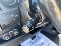 A close-up of a turn signal lever in a 2020 RAM ProMaster 3500 featuring various control options for headlights and wipers