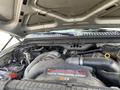 Close-up of a 2007 Ford F-350 SD engine showing the Power Stroke V8 Turbo Diesel components and various hoses and pipes