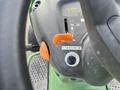 Close-up of the control panel of a 2021 John Deere L Series S lawn mower featuring the choke lever and ignition switch