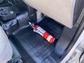 A fire extinguisher is placed on the floor of a 2018 Ford F-150 truck's cabin