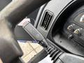 A close-up view of the control lever on the steering wheel of a 2017 Autocar Xpert featuring indicators and a headlight switch