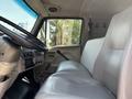 Interior view of a 2006 Sterling Acterra showing a steering wheel and two white seats with a gear shift and dashboard controls visible