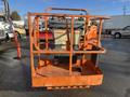 A 2012 JLG E400AJFN aerial work platform with an orange cage and control panel visible from the front