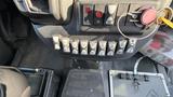Control panel of a 2021 Ford Transit featuring various buttons for vehicle operations including lights and emergency functions