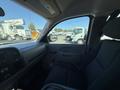 Interior view of a 2013 Chevrolet Silverado 1500 with a focus on the driver's side seat and dashboard