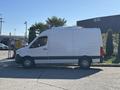 A 2021 Mercedes-Benz Sprinter 2500 van with a white exterior and black accents parked with a sleek design and large cargo area