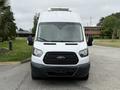 A front view of a 2017 Ford Transit van featuring a white exterior and a black grille with the Ford logo