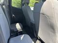 Interior view of a 2017 Chevrolet Colorado showing the rear seating area with gray fabric seats and a center console
