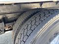Close-up of two tires from a 2020 Hino 338 showing tread pattern and grooves