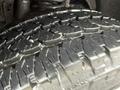 Close-up of a rugged tire tread on a 2008 Ford F-250 SD showcasing deep grooves and a robust design suitable for off-road conditions