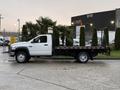 A 2008 Sterling Bullet flatbed truck is parked with its cab visible on the left side and a flatbed platform extending out with a railing along the edges