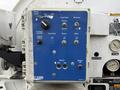 Control panel of a 2013 International Workstar 7500 with buttons for pump mode hose reel and boom operations along with a footage counter and blower settings